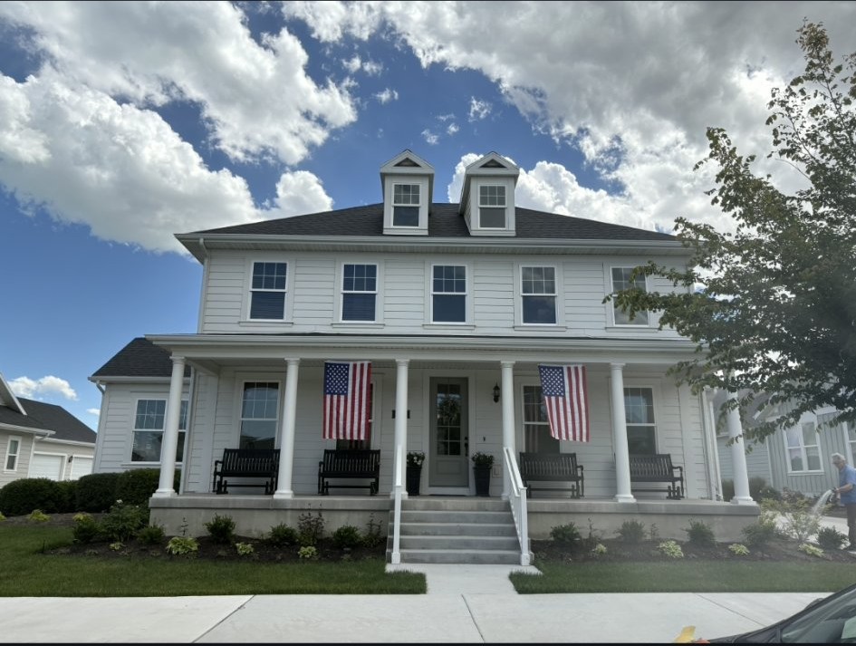 White two-story home exterior, front view